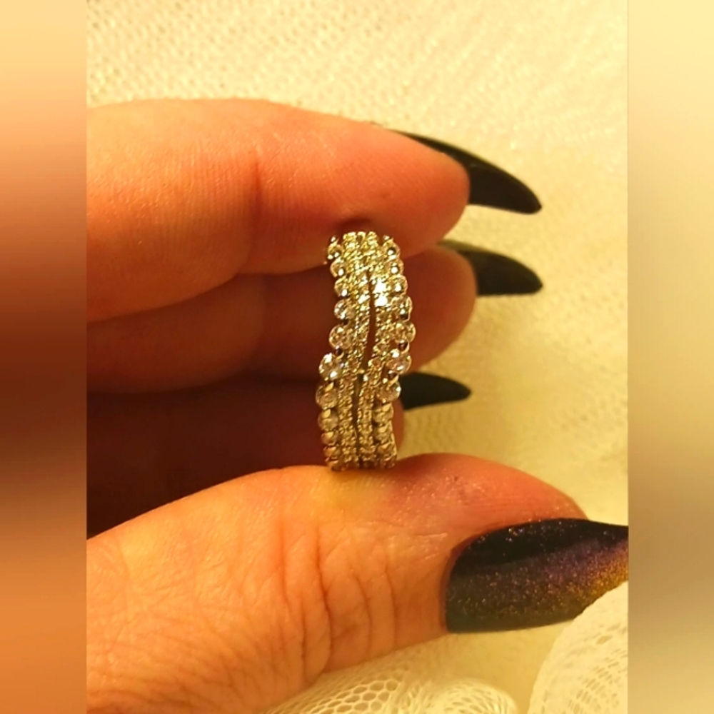 Waves of Brilliant-Cut White Sapphires on a Sterling Silver Band